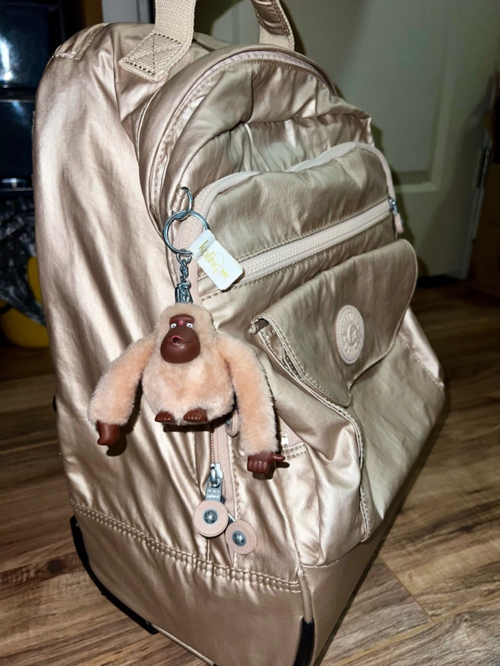 Kipling Metallic Champagne 2-wheeled Rolling Backpack